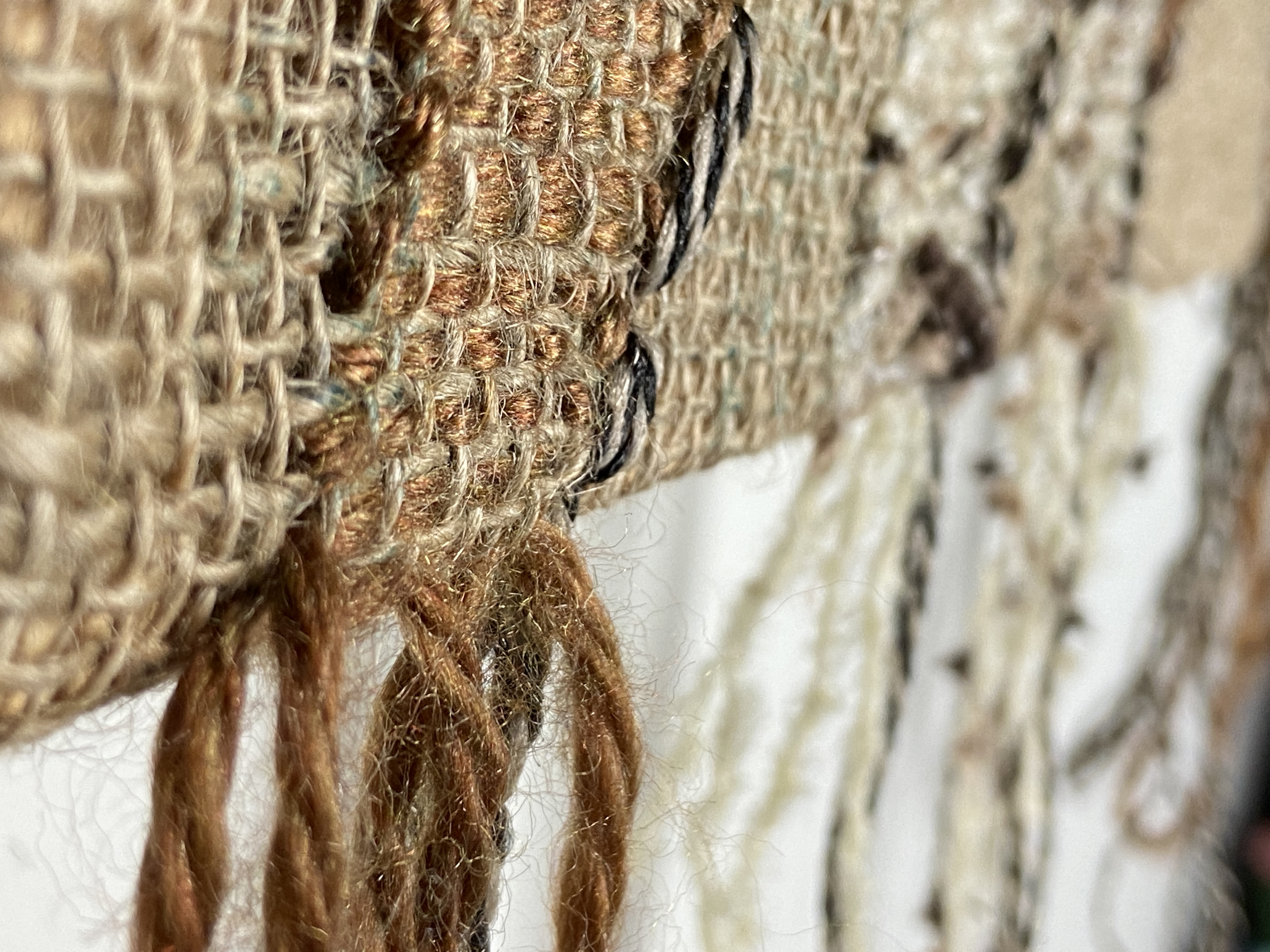 Detail of woven fiber and loose threads